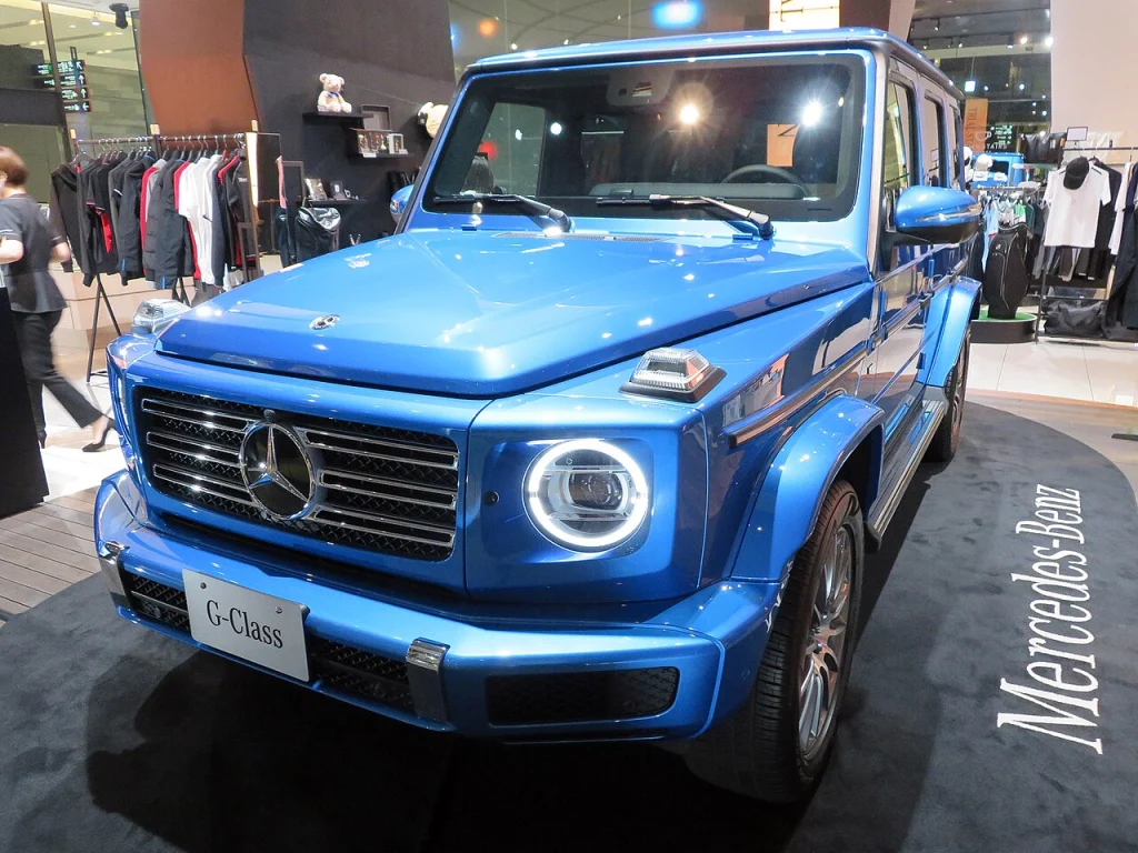 Blue Mercedes-Benz G 550 displayed indoors