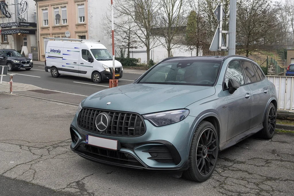 Silver-green Mercedes-AMG GLC 63 S E PERFORMANCE Coupe parked outside