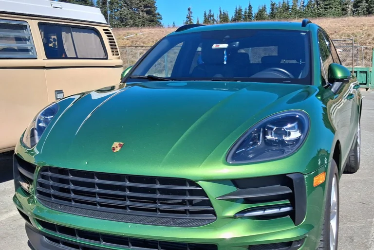 Green Porsche Macan, front three-quarter view