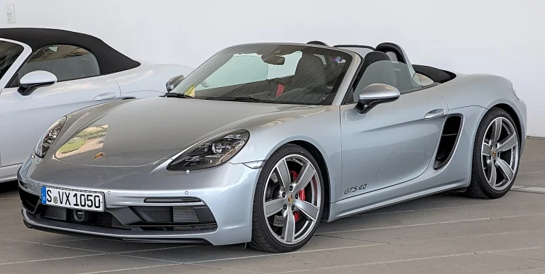 Silver Porsche 718 Boxster GTS 4.0 with its roof lowered
