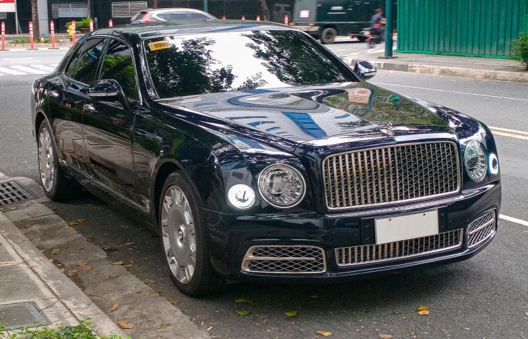 Dark Bentley Mulsanne extended-wheelbase sedan parked beside a street