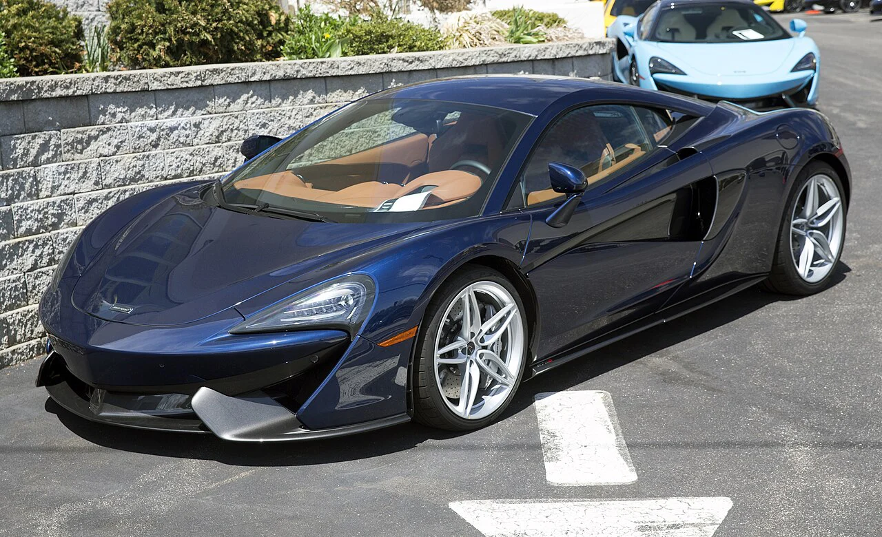 Blue McLaren 570S coupe parked on a street