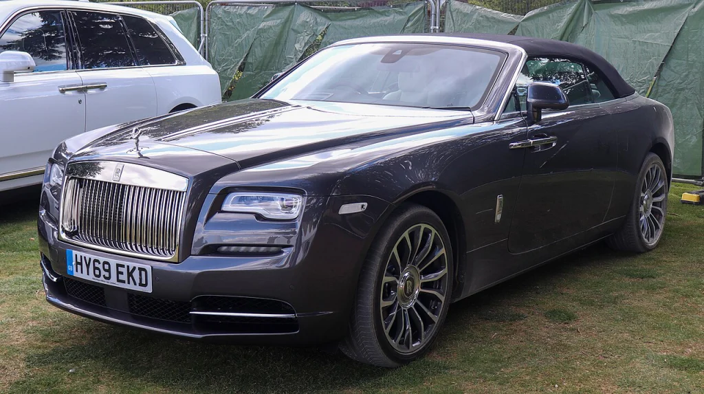 Dark blue Rolls-Royce Dawn convertible with its roof lowered
