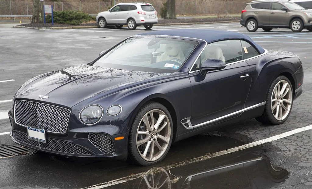 Dark blue Bentley Continental GT convertible with its roof lowered