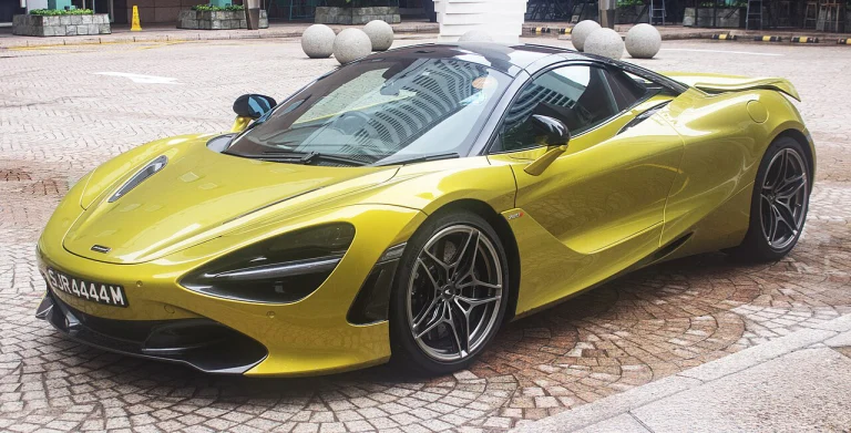 Yellow-green McLaren 720S with a roof-mounted light bar