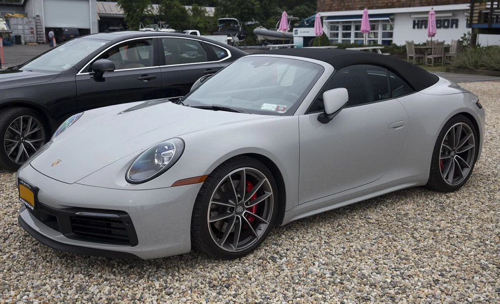 Gray Porsche 911 Carrera 4S Cabriolet with its roof raised