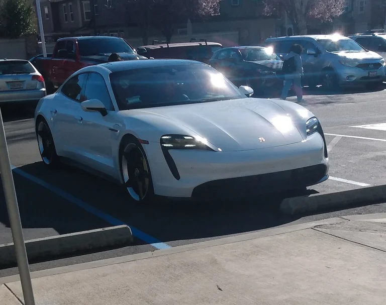 White Porsche Taycan Turbo S parked outside