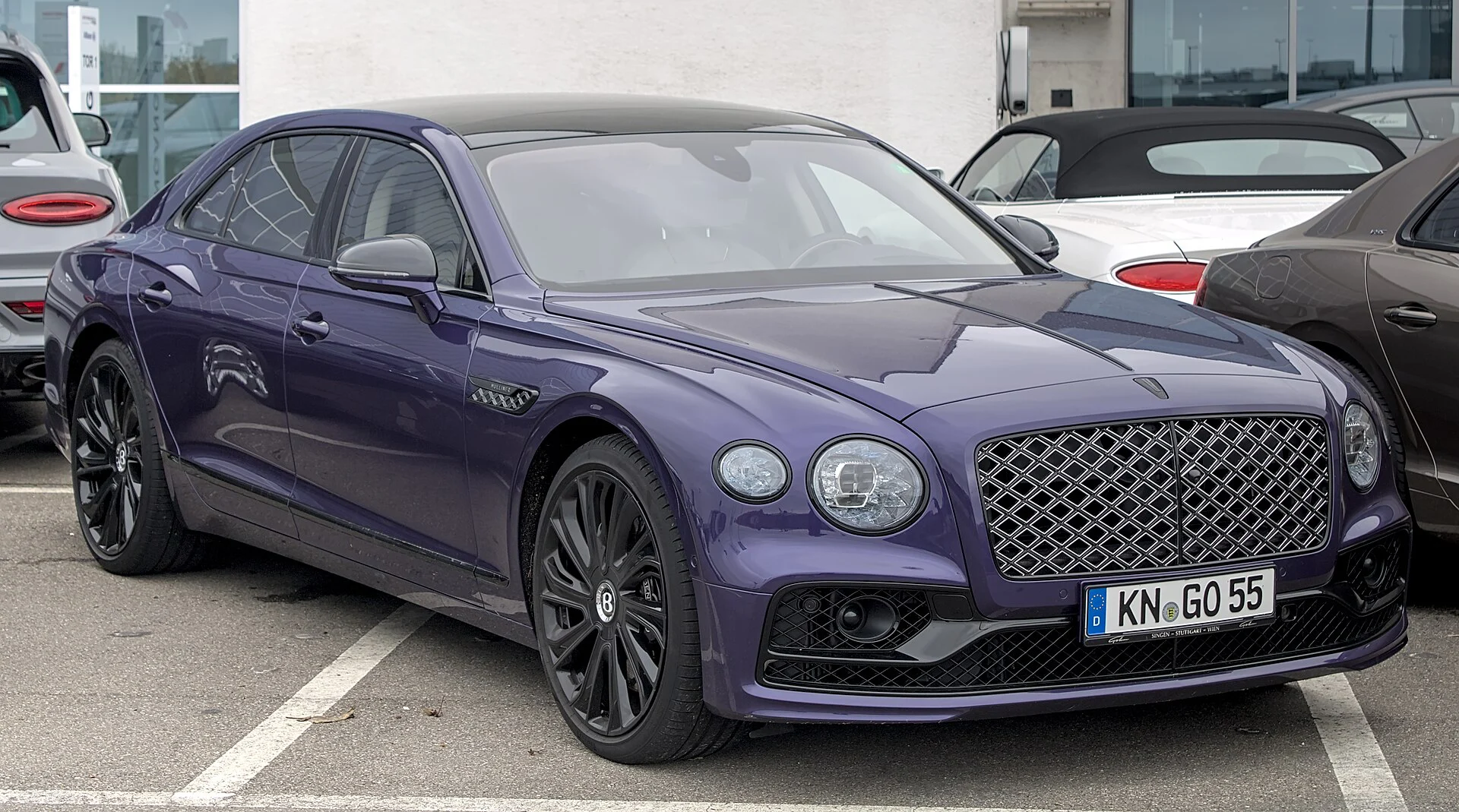 Purple Bentley Flying Spur Mulliner sedan, front three-quarter view