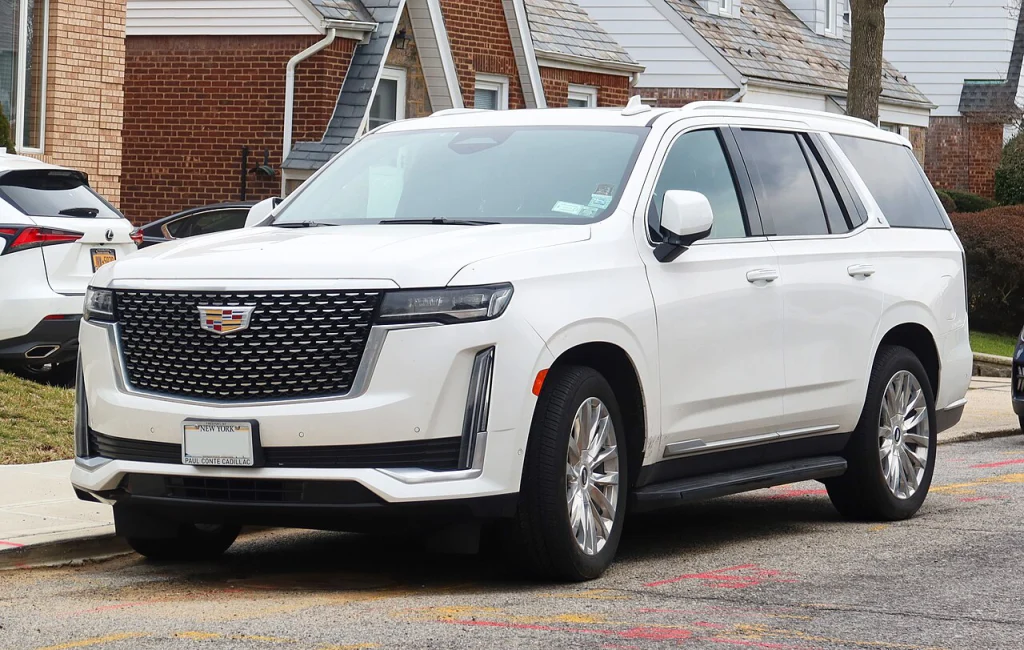 White Cadillac Escalade Premium Luxury parked on a street