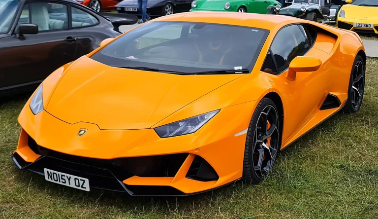 Orange Lamborghini Huracan EVO parked on a street