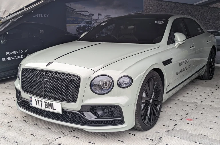 White Bentley Flying Spur Speed displayed indoors
