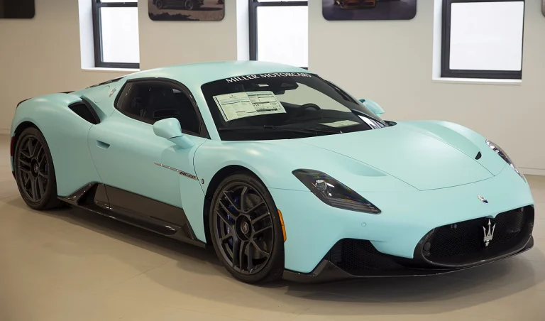 Mint-green Maserati MC20 coupe in a showroom