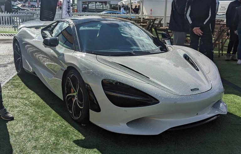 Silver McLaren 750S displayed on grass