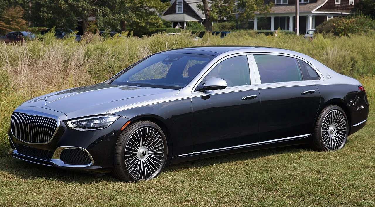 Black and silver Mercedes-Maybach S 580 sedan parked on grass