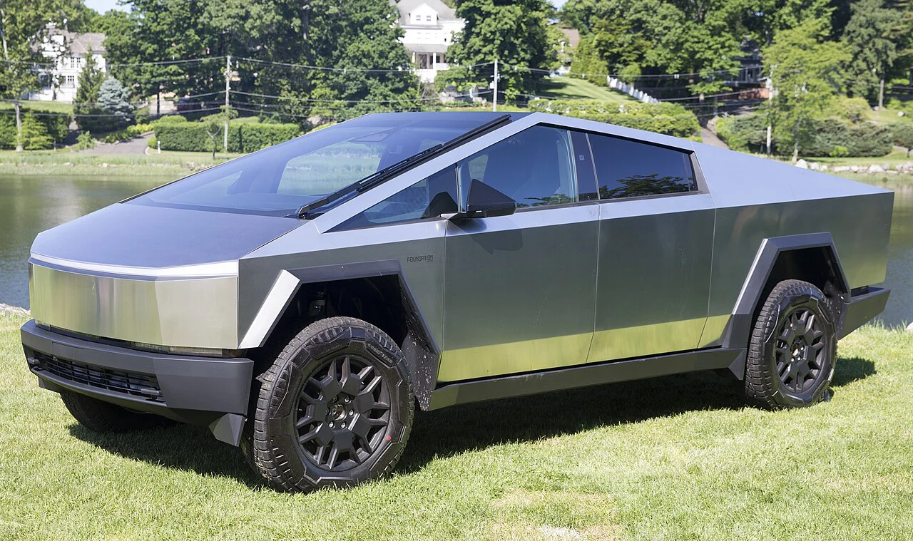 Tesla Cybertruck Foundation Series parked beside grass