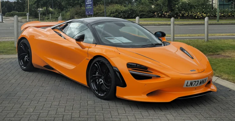 Orange McLaren 750S parked beside a road