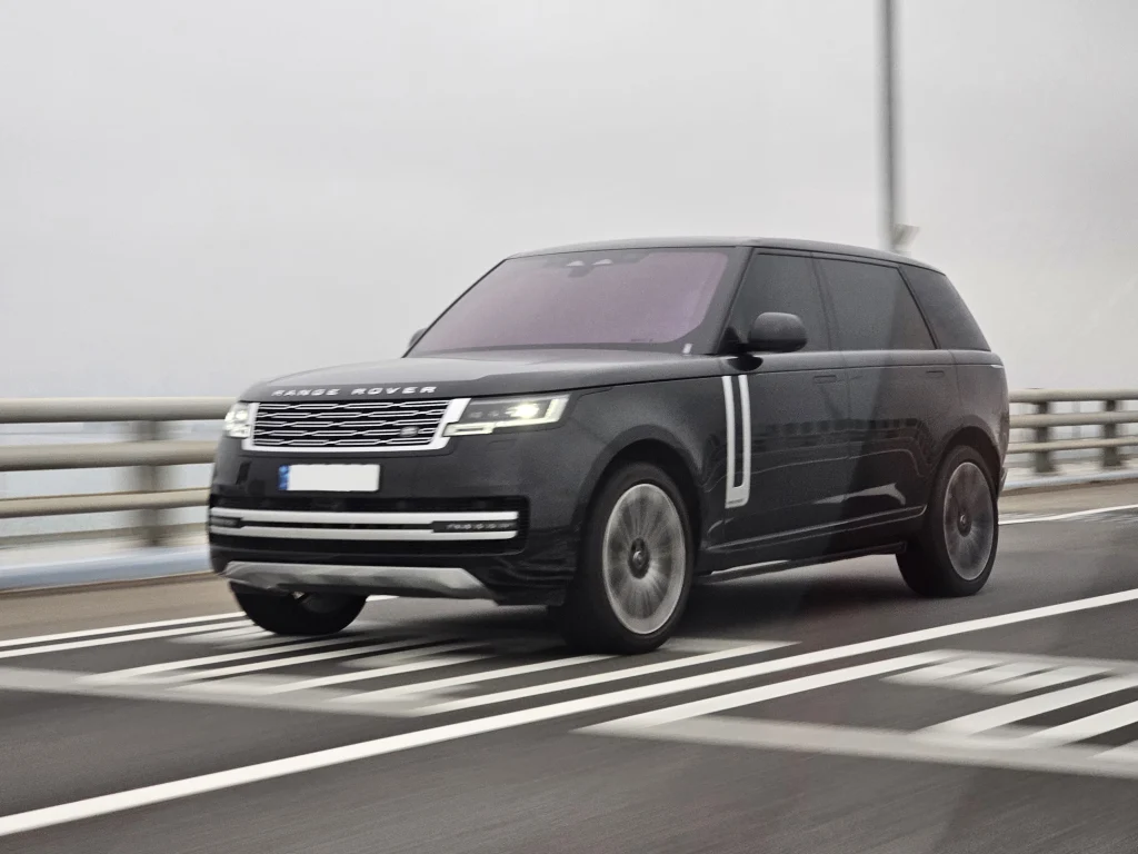Black long-wheelbase Range Rover Autobiography driving on a road
