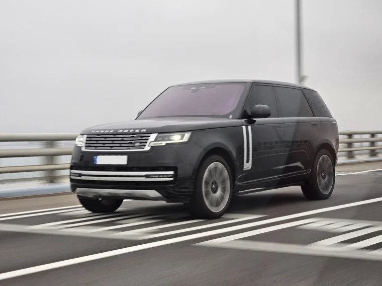 Black long-wheelbase Range Rover Autobiography driving on a road