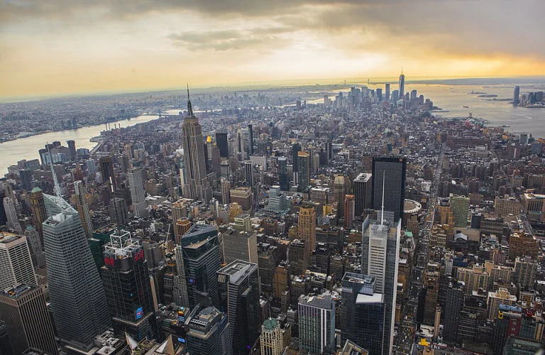 Aerial view of Manhattan and its surrounding rivers at sunset