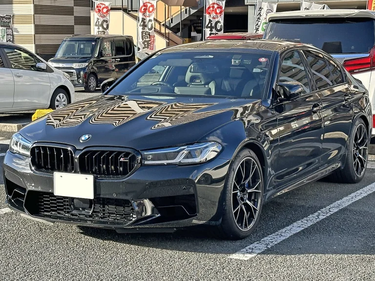 Black BMW M5 Competition sedan parked on a street