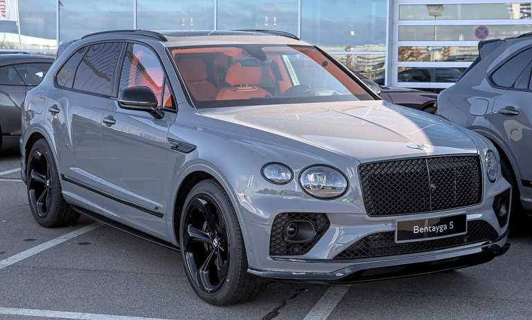 Silver Bentley Bentayga S with a red interior