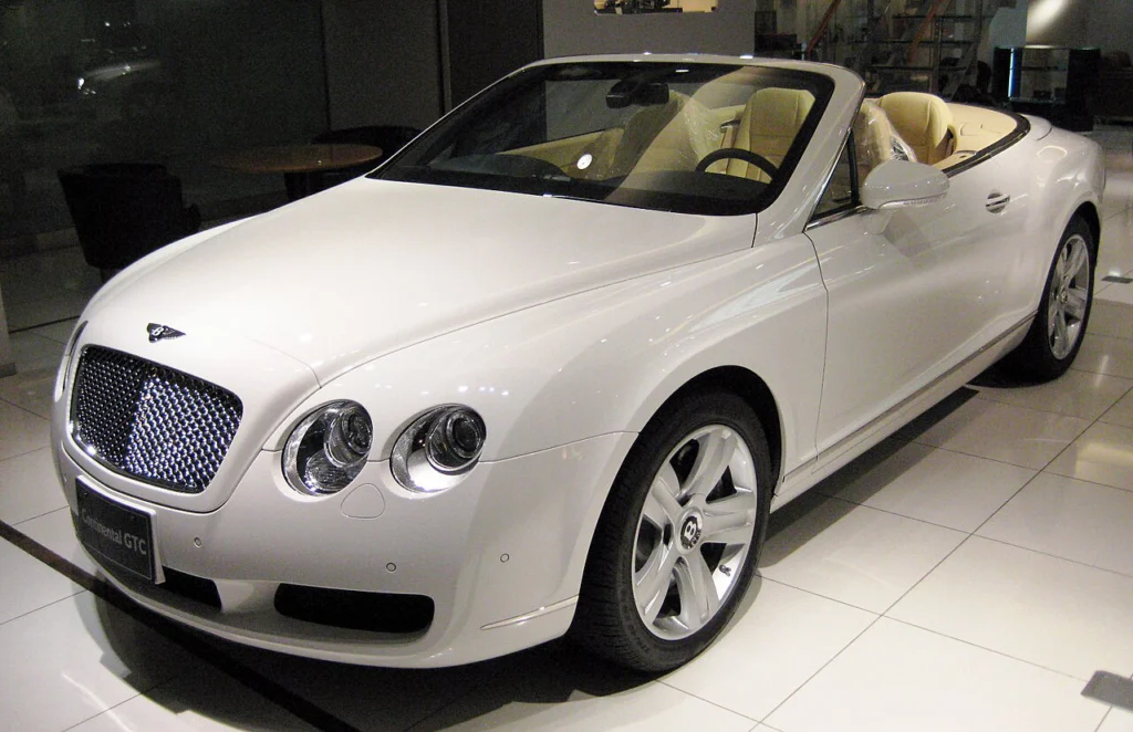 White Bentley Continental GTC convertible displayed indoors