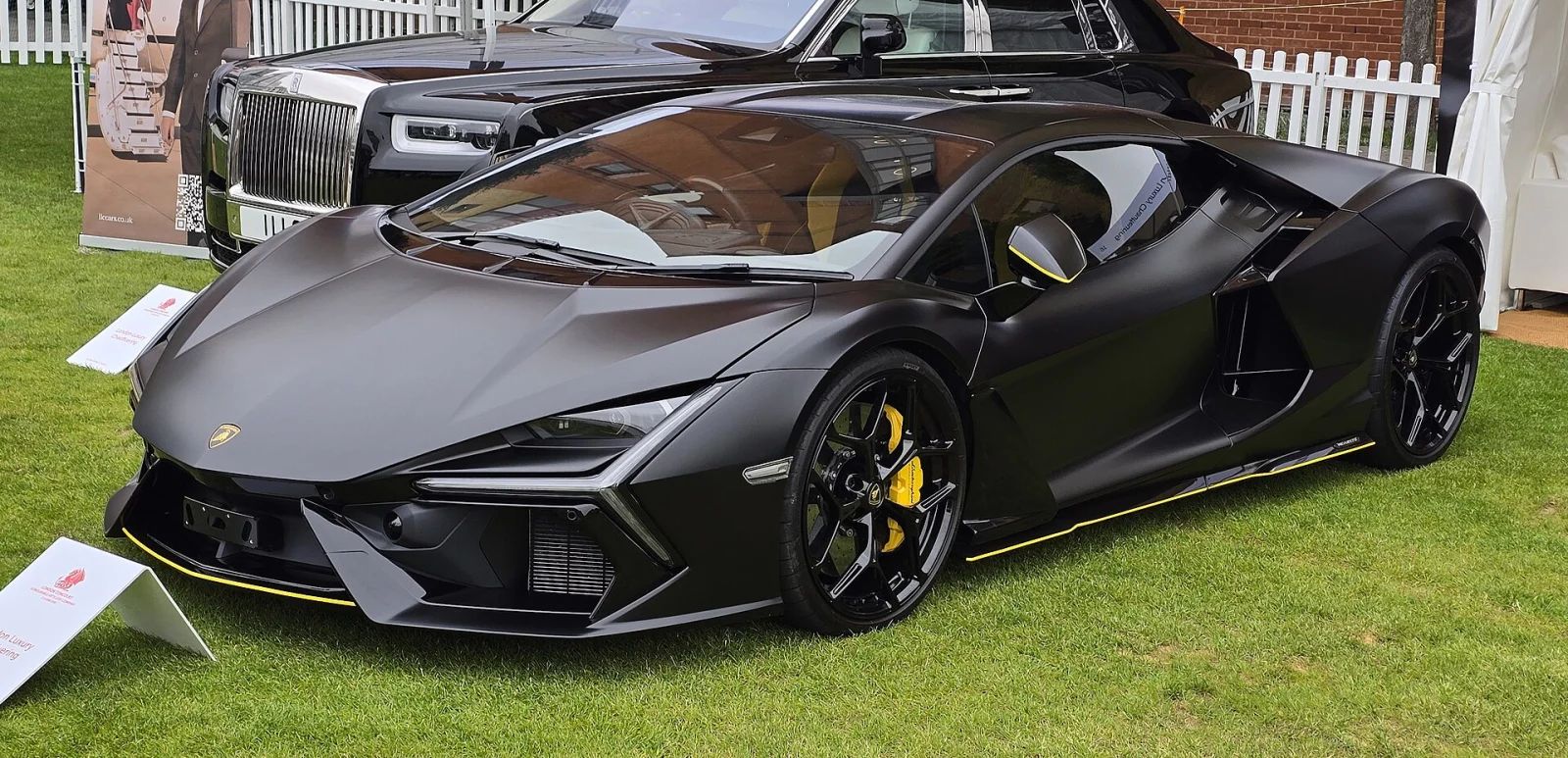 Black Lamborghini Revuelto displayed on grass