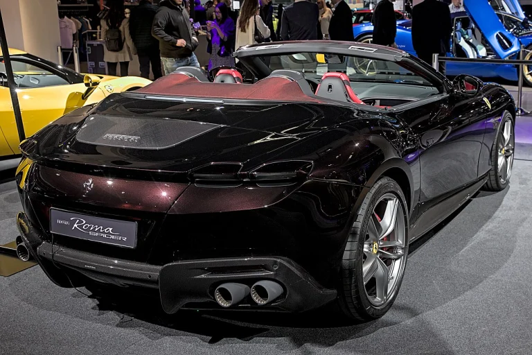 Rear three-quarter view of a Ferrari Roma Spider with its roof lowered
