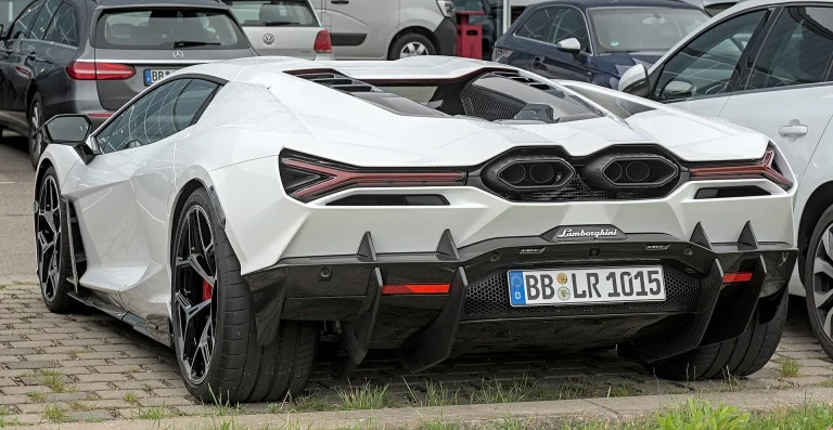 Rear three-quarter view of a white Lamborghini Revuelto