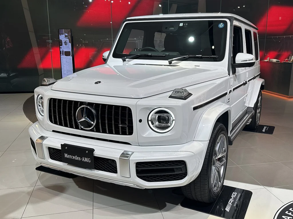 White Mercedes-AMG G 63 SUV on an indoor display