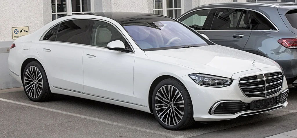 White Mercedes-Benz S-Class sedan, front three-quarter view