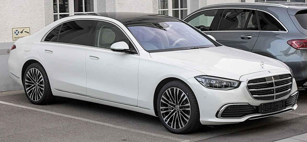 White Mercedes-Benz S-Class sedan, front three-quarter view