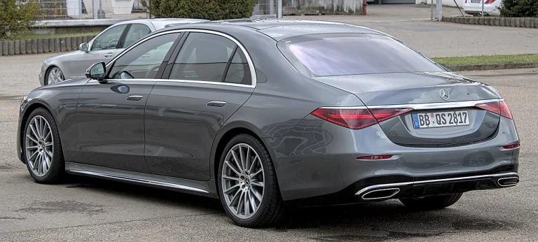 Rear three-quarter view of a gray Mercedes-Benz S-Class sedan