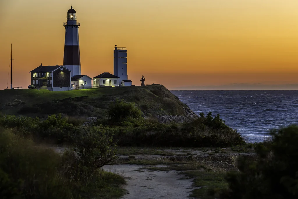Montauk Point Lighthouse overlooking the coast at sunset