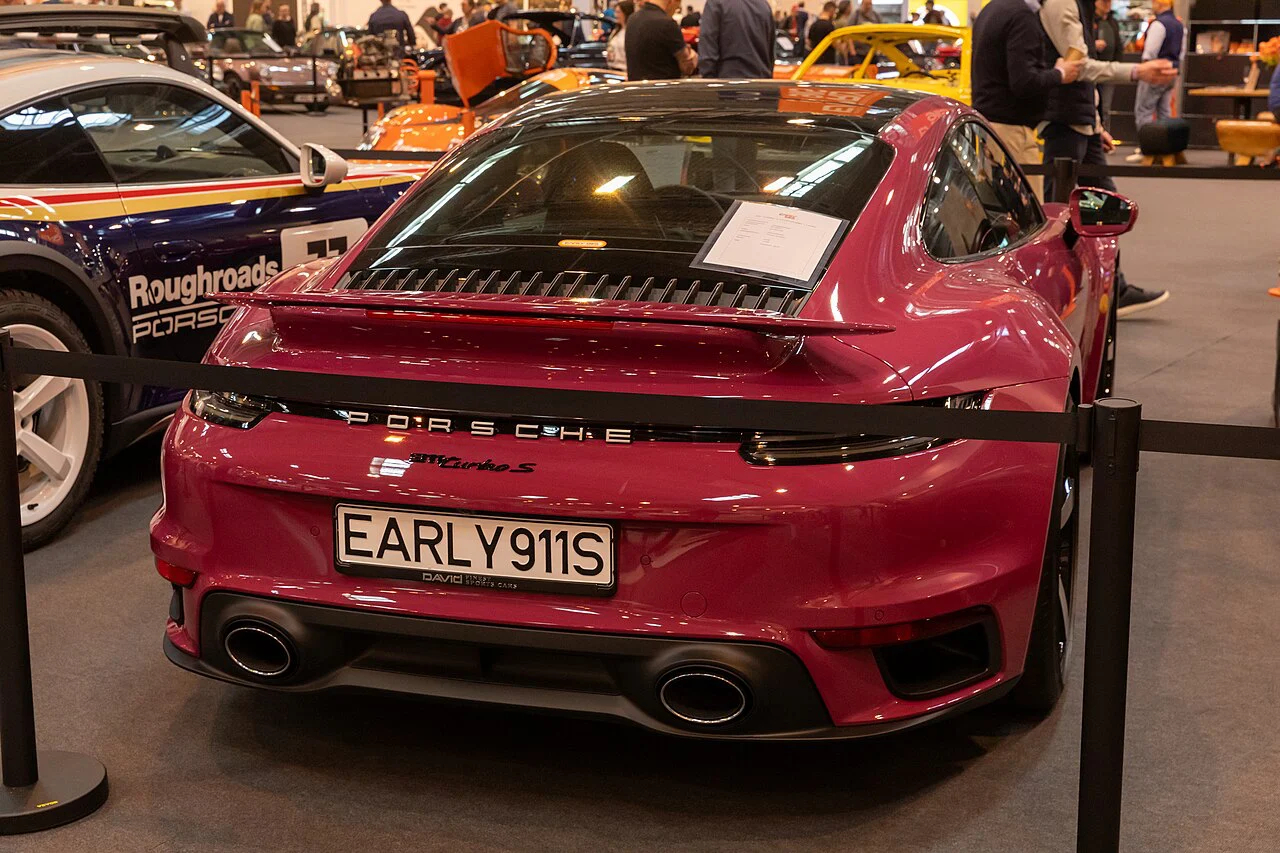 Rear view of a red Porsche 911 Turbo S on a motor-show display