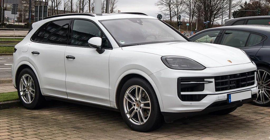 White Porsche Cayenne SUV, front three-quarter view