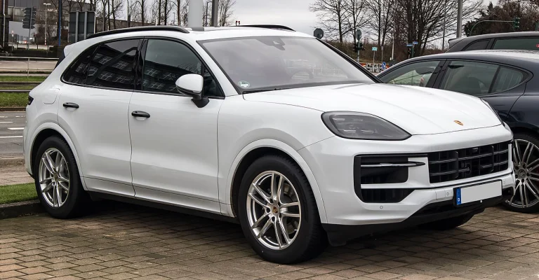 White Porsche Cayenne SUV, front three-quarter view